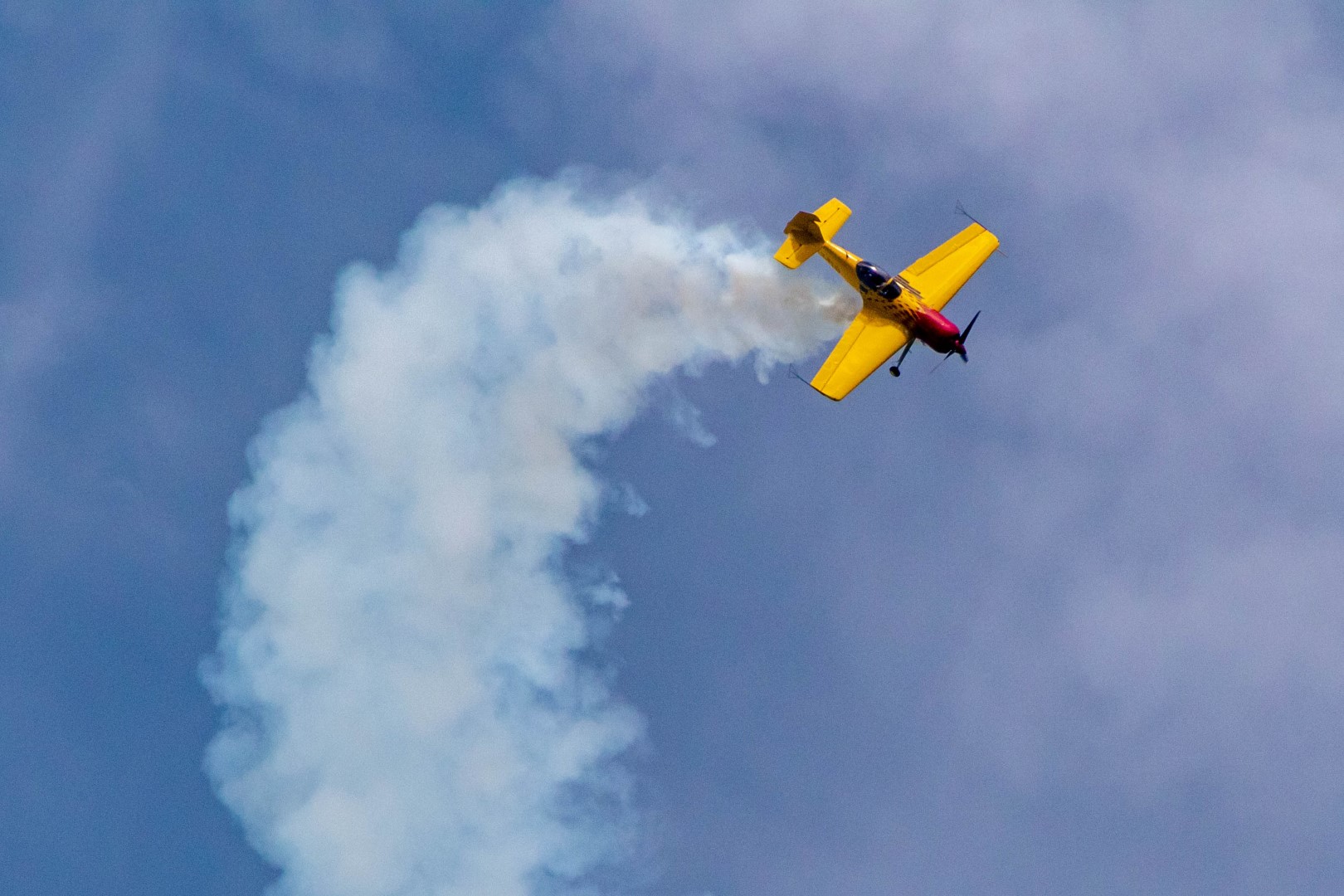 Airplane performing a flat spin at an airshow